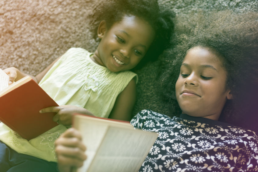 Little Girls Lay On Carpet