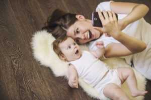 Mother & Baby On Hardwood Floor